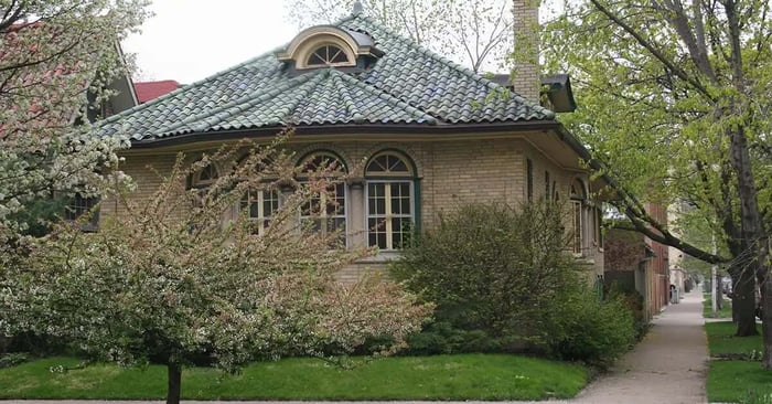 Brick bungalow home on a tree-lined residential street in West Ridge Chicago