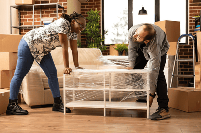 Couple preparing to store furniture