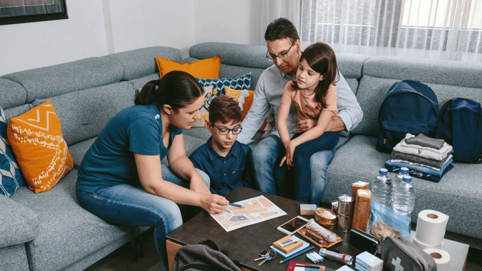 Family using a California earthquake preparedness checklist to organize emergency supplies