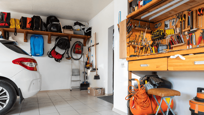 Organized garage with labeled bins and shelving illustrating practical garage organization tips