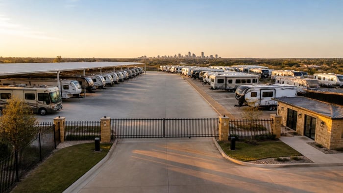 RV storage in Fort Worth, TX with motorhomes and travel trailers parked at a gated storage facility
