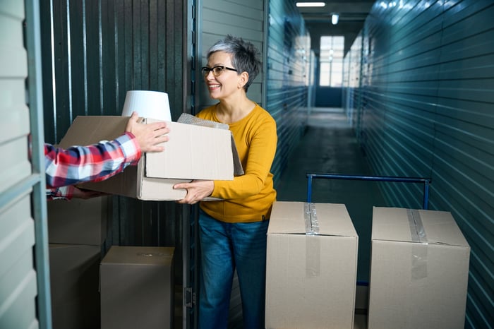 How much is a storage unit in Northeast Houston with a customer moving boxes into an indoor storage unit