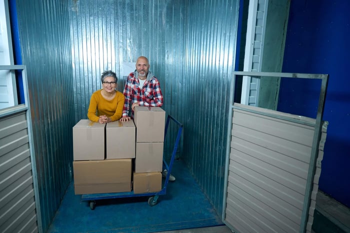 Storage unit cost in Beaumont TX with customers loading boxes into a self-storage unit