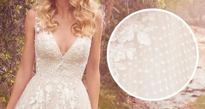 This particular type is a lightweight lace featuring small oval dots scattered over an illusion of net or tulle fabric