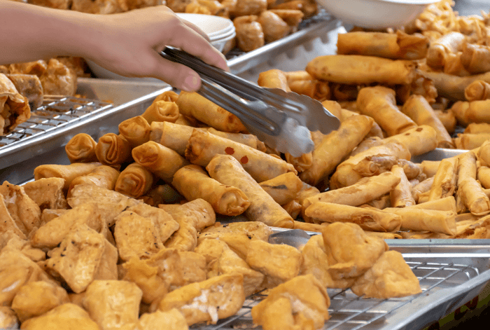 Seen These Yellow and Red Flags All Over Thailand? Your Guide to the "Kin Je" Vegetarian Festival.