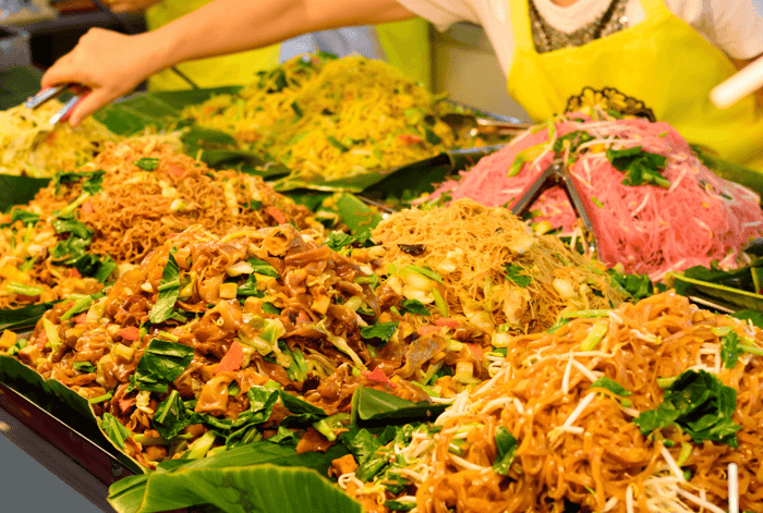 Seen These Yellow and Red Flags All Over Thailand? Your Guide to the "Kin Je" Vegetarian Festival.