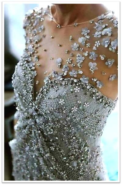 Few textiles can elevate a garment as dramatically as embellished lace. It transforms simple silhouettes into masterpieces