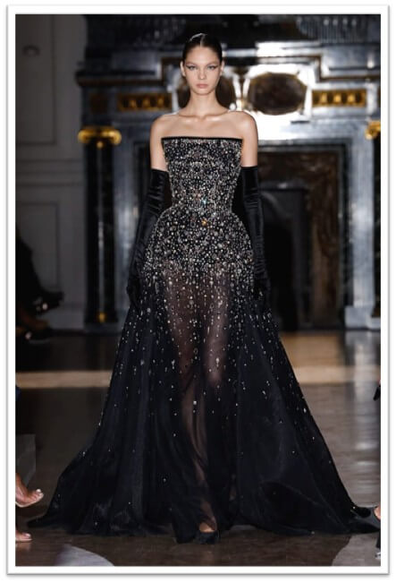 Marchesa: Uses sheer lace paired with pearls and delicate appliqués to create ethereal evening gowns.