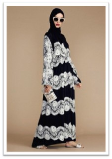 A black crepe abaya with white lace cuffs and hem can create a bold, yet respectful statement