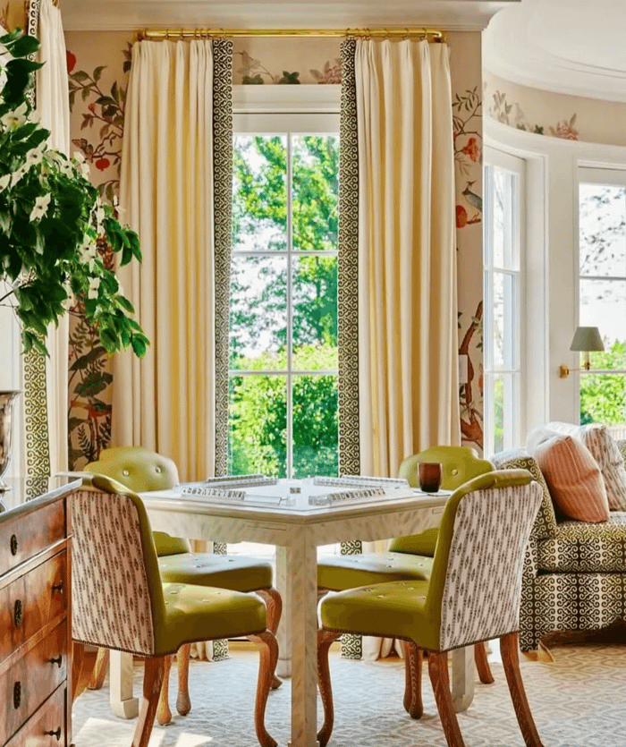 Mahjong Game Room with White Table and Green Velvet Chairs