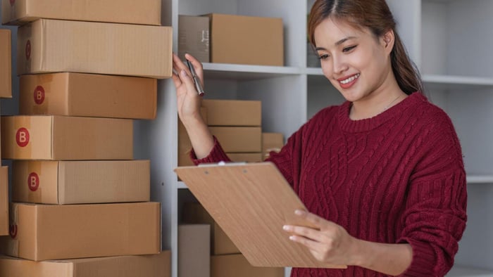 A women is-organizing the boxes in the self storage