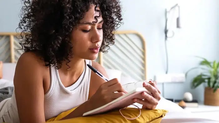 Person Making a note of what to store in a storage unit