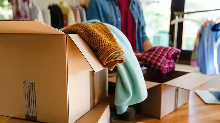 Storage Box being packed with clothes.