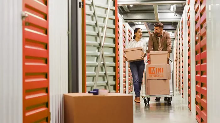 a young couple using climate controlled storage at Mini Mall Storage
