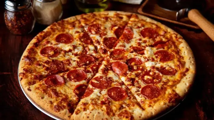 A pizza at Olympic Steak and Pizza