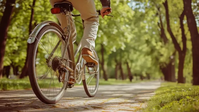 A biker on a trail on the Atoka Greenway Trail