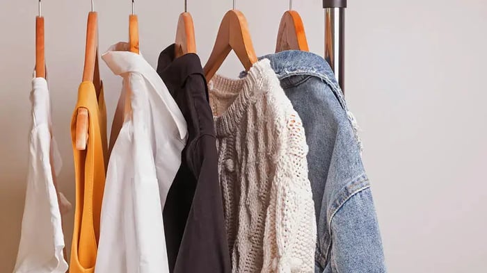 Clothing hanging on a rack for a capsule wardrobe