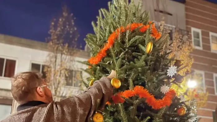 Christmas tree decorating with Mini Mall Storage ornaments