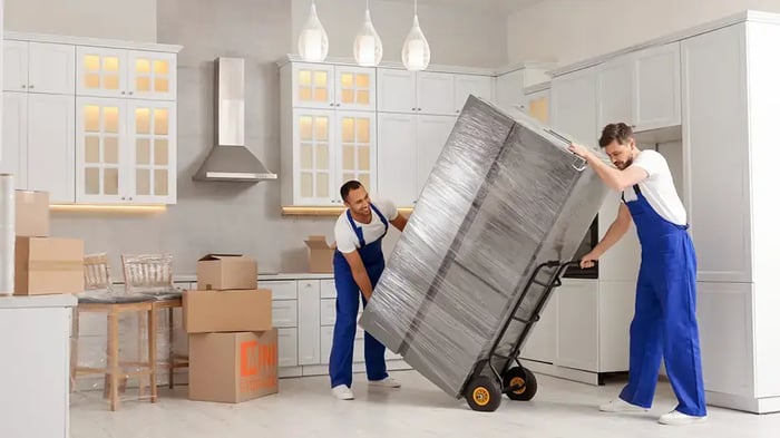 wrapped fridge and boxed kitchen items ready to be stored at Mini Mall Storage