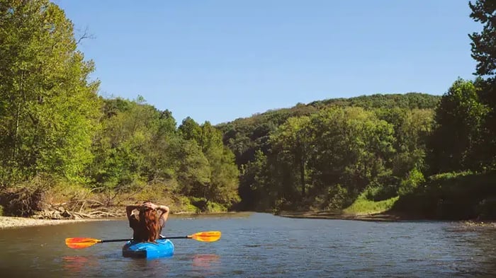 A woman kayaking on Licking River in Ohio
