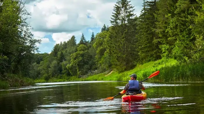 A man kayaking on Boone Lake in Piney Flats, TN
