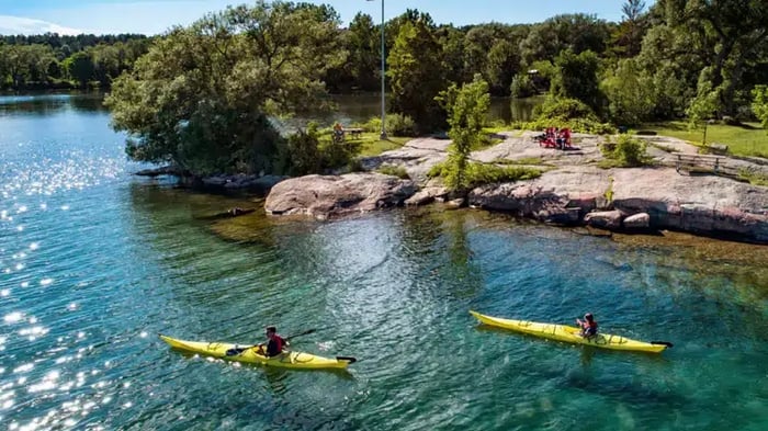 Two people enjoying the day kayaking on the St. Lawrence River
