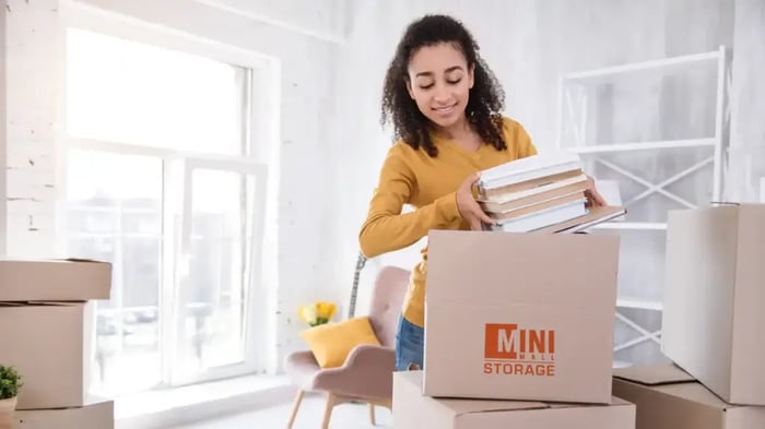 A student packing boxes from Mini Mall Storage to head off to university