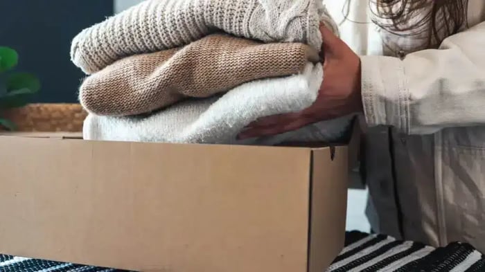 sweaters being packed away for seasonal storage