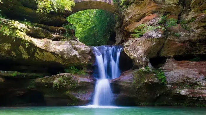 a waterfall under a bridge in Ohio