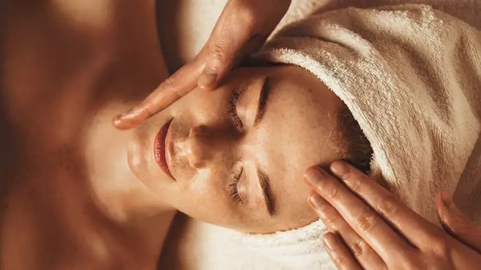 Woman receiving spa facial