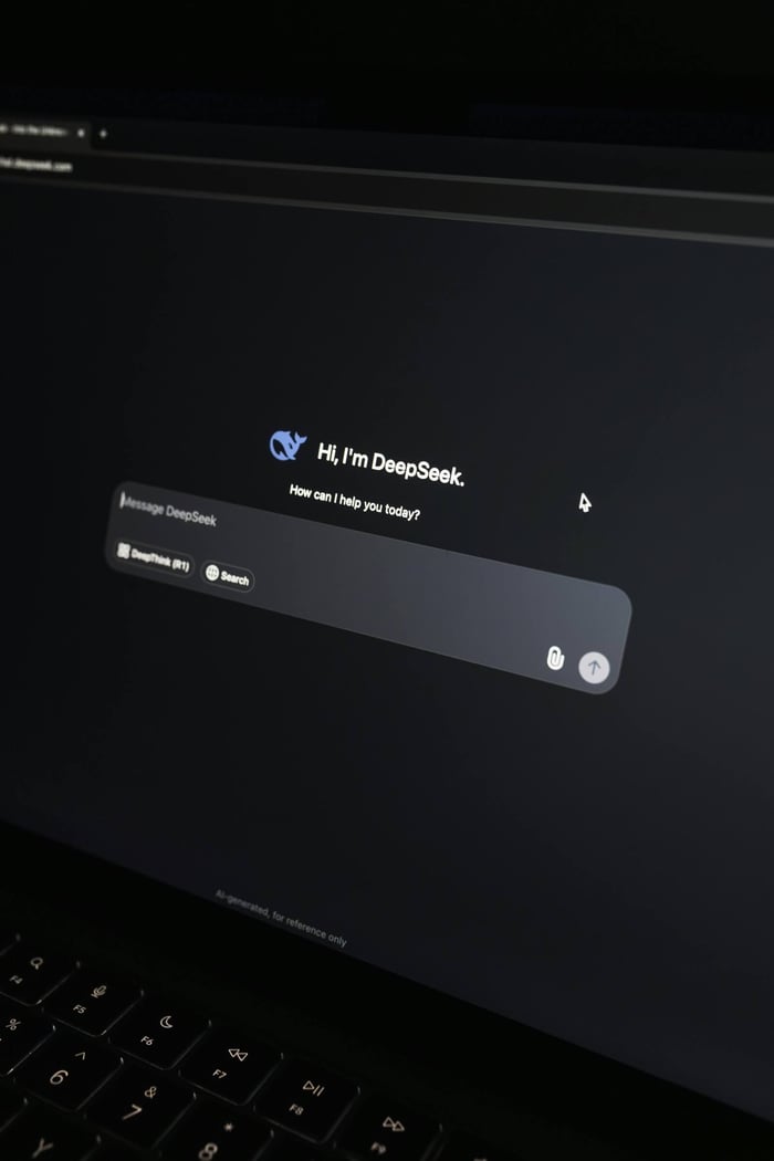 Close-up of an AI chat interface on a laptop screen in a dark setting.