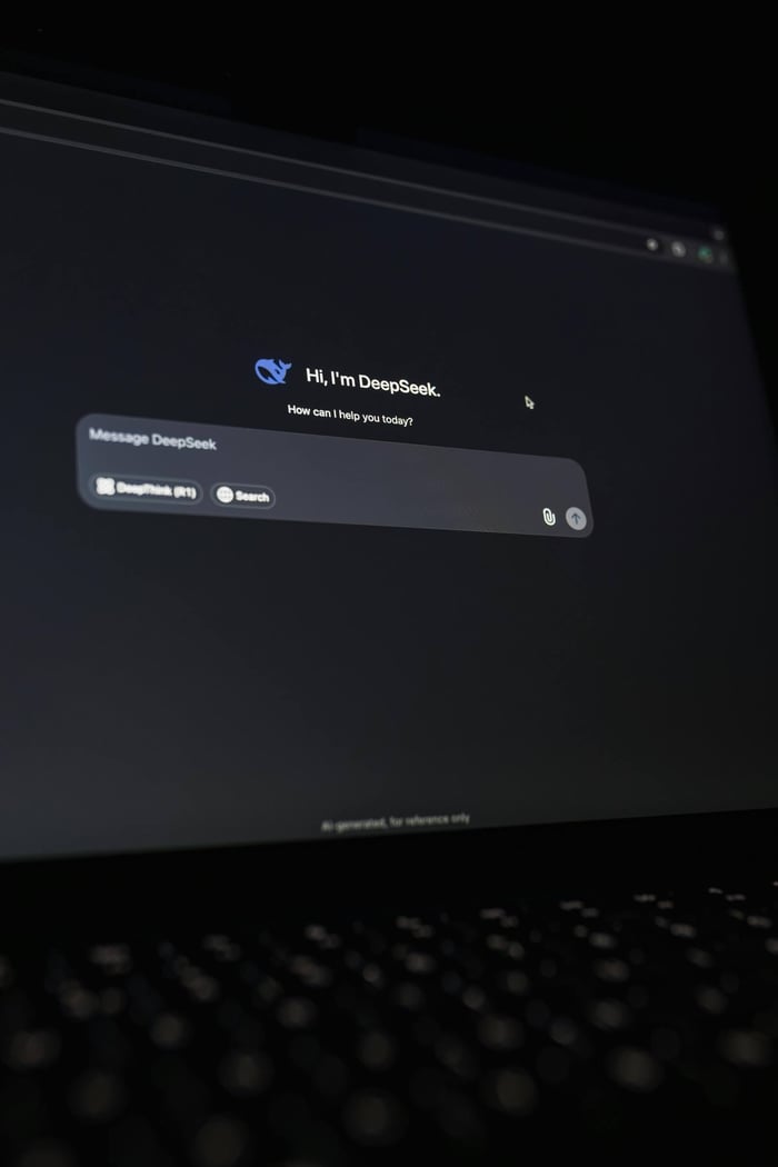 A close-up view of the DeepSeek AI chat interface displayed on a laptop screen in dark mode.