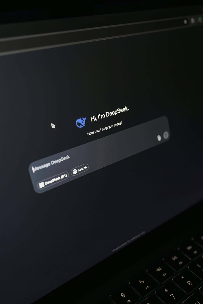 Close-up of a laptop screen displaying an AI chatbot interface with a dark theme.