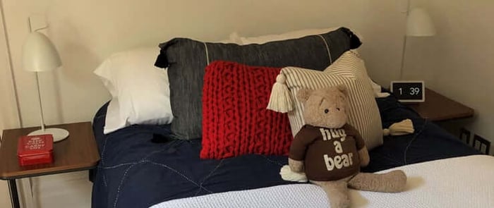 Bedroom with light bed linens