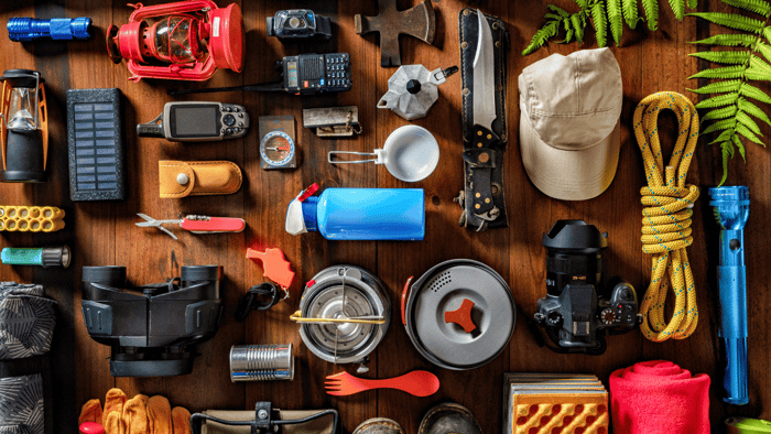 Organized camping supplies showing storage solutions for outdoor gear