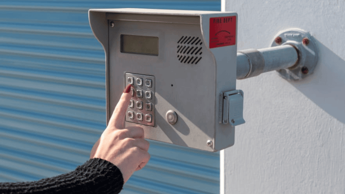 Storage property access keypad and lock attached to a storage unit door