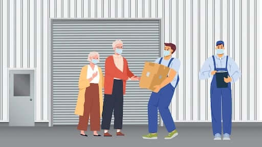 A cartoon of movers helping an older couple at a storage unit.