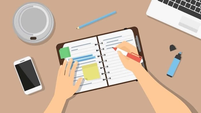 A cartoon of a person writing in a journal.