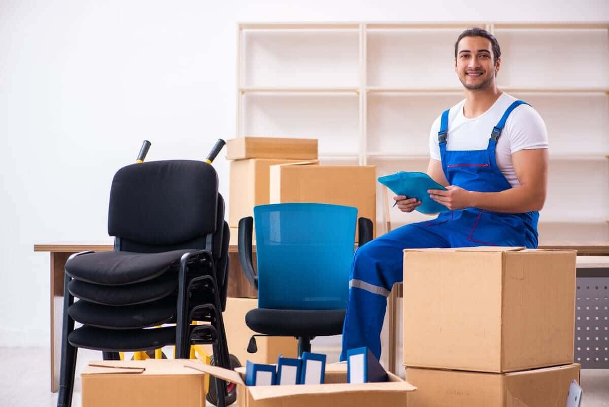 Young Man Packing Boxes and Inventory for Business Self Storage in Winston Salem, NC