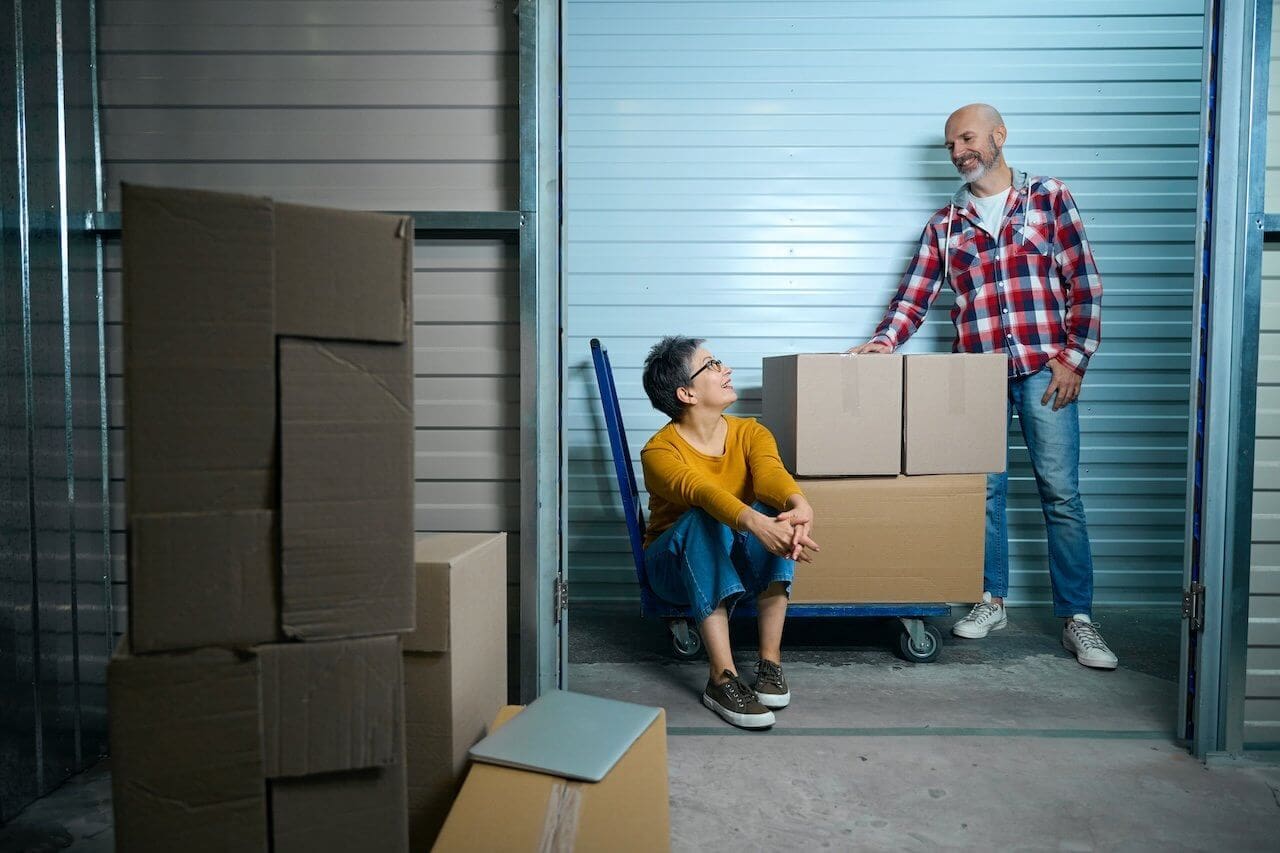 couple storing items in a 10x10 storage unit
