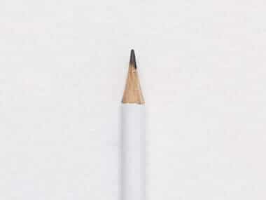 Minimalist sharpened white pencil isolated on white background