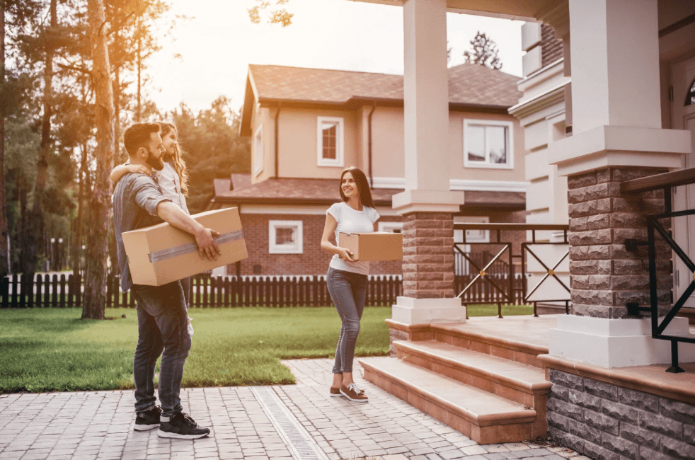 Couple moving items into a summer storage unit